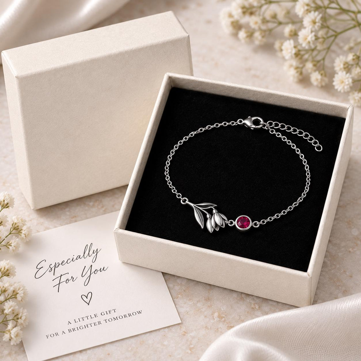 Silver tone birth flower bracelet in a gift box
