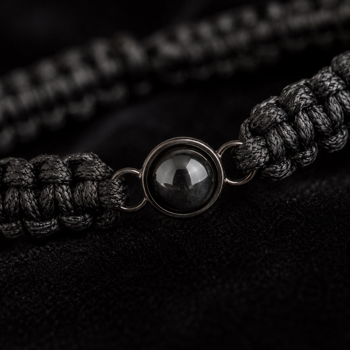 Close-up of the braided cord and round projection charm