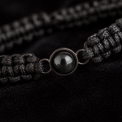 Close-up of the braided cord and round projection charm