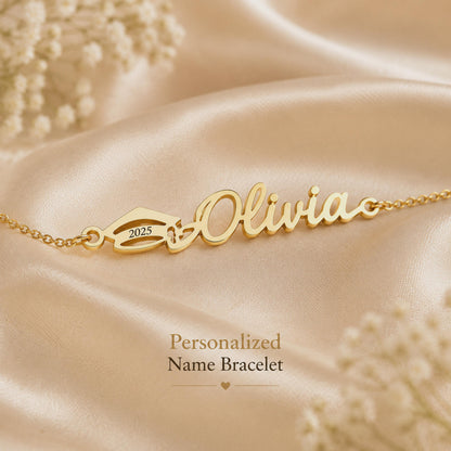 Gold tone Olivia name bracelet with a year plate on satin