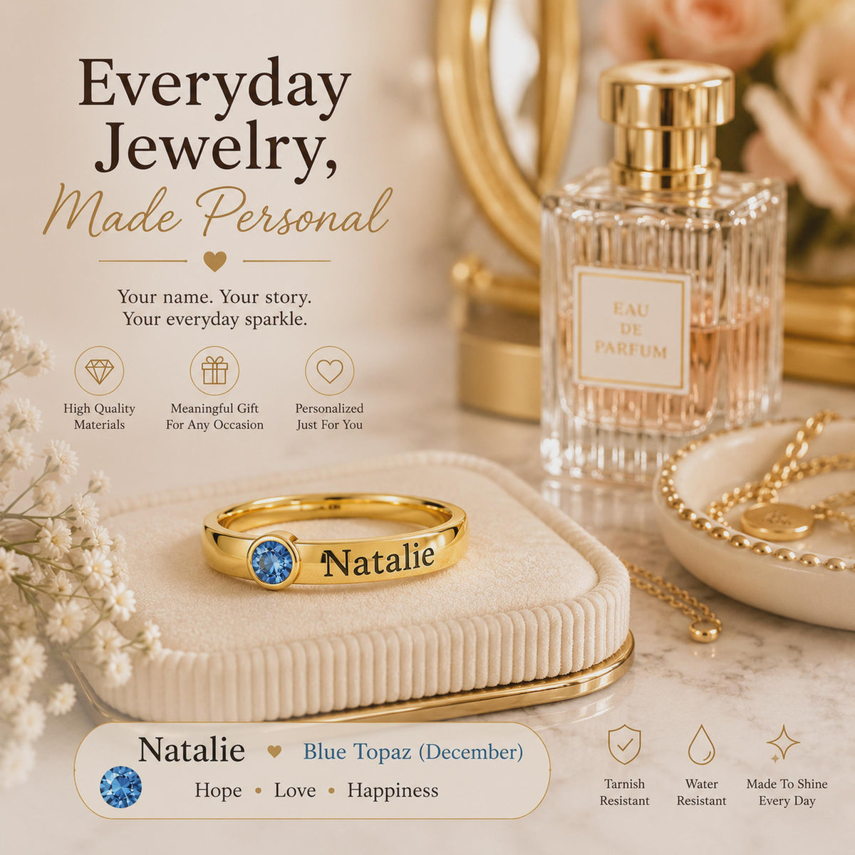 Gold tone Natalie name ring with a December blue stone on a dressing table