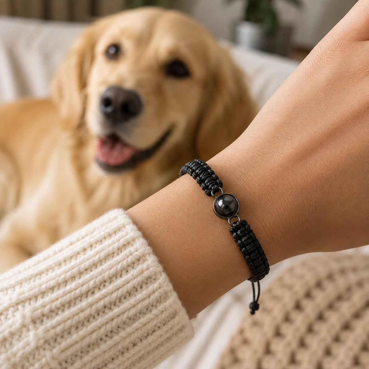 Black braided projection bracelet worn on the wrist