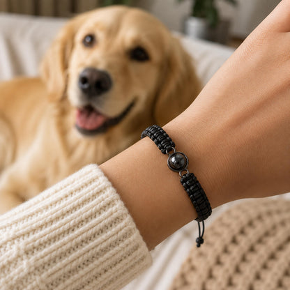 Black braided projection bracelet worn on the wrist