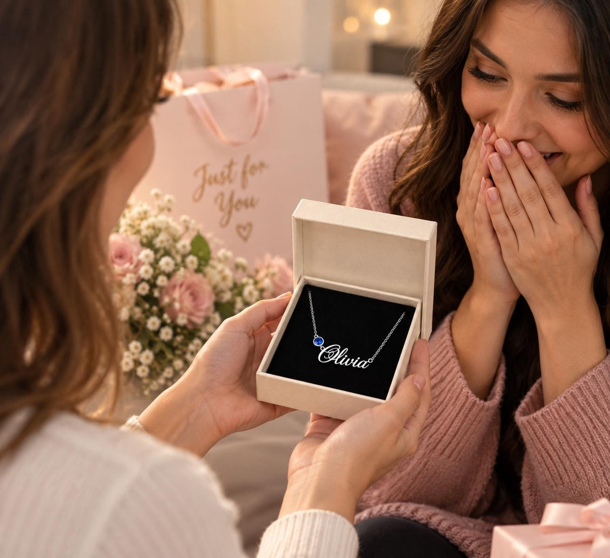 Woman opening a name necklace gift