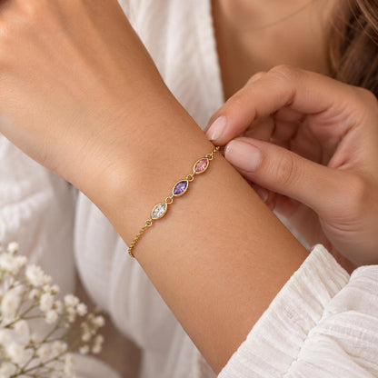 Leaf birthstone bracelet worn on the wrist, close up