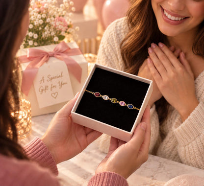 Woman receiving a leaf birthstone bracelet gift