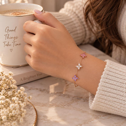 Butterfly birthstone bracelet held in the hand