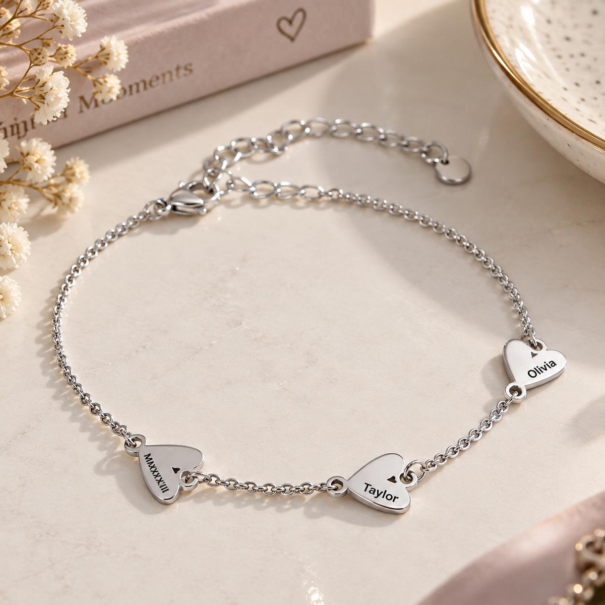 Silver tone heart name bracelet