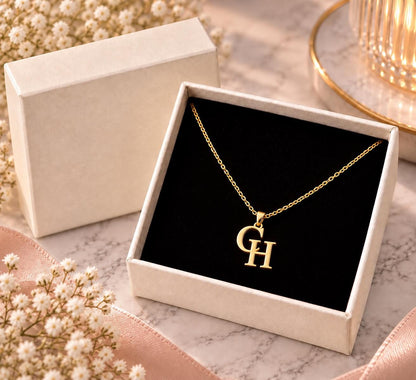 Gold tone double initial necklace in a gift box