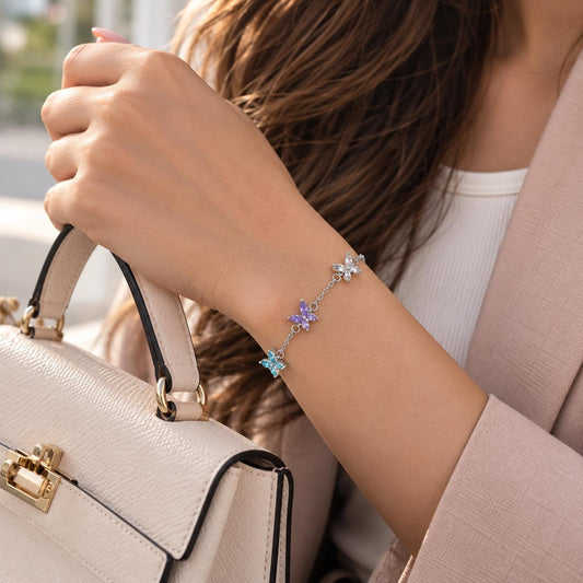 Butterfly birthstone bracelet with colored butterfly stones worn on the wrist