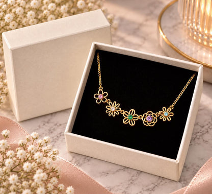 Gold tone family birth flower necklace in a gift box
