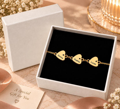 Gold tone heart name bracelet in a gift box
