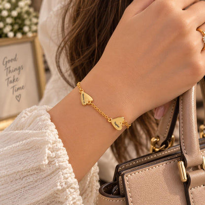 Gold tone engraved heart charms, close up
